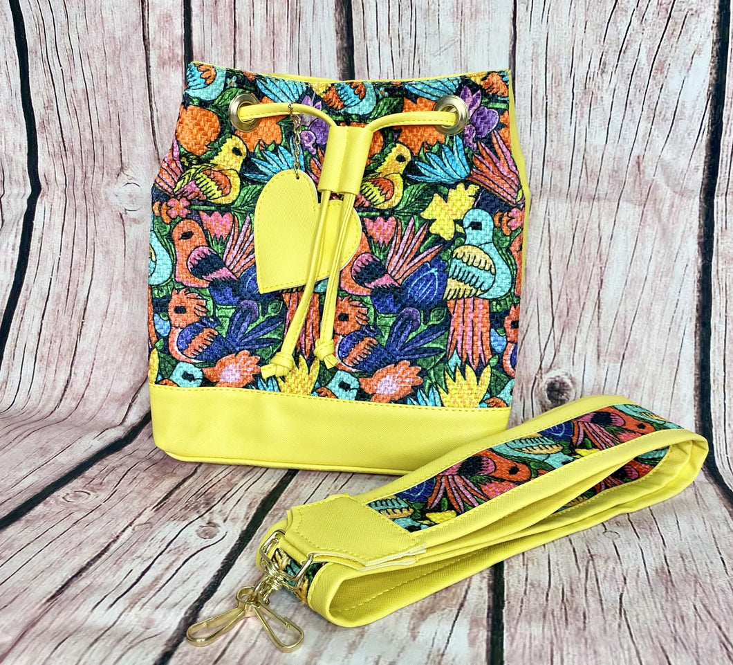 yellow artisanal purse with bird design